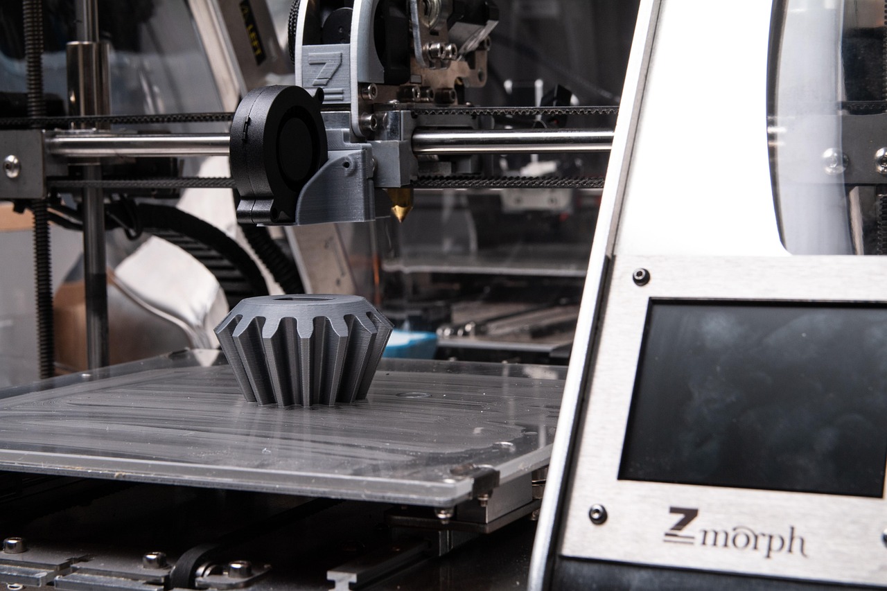 3D printer producing a grey object